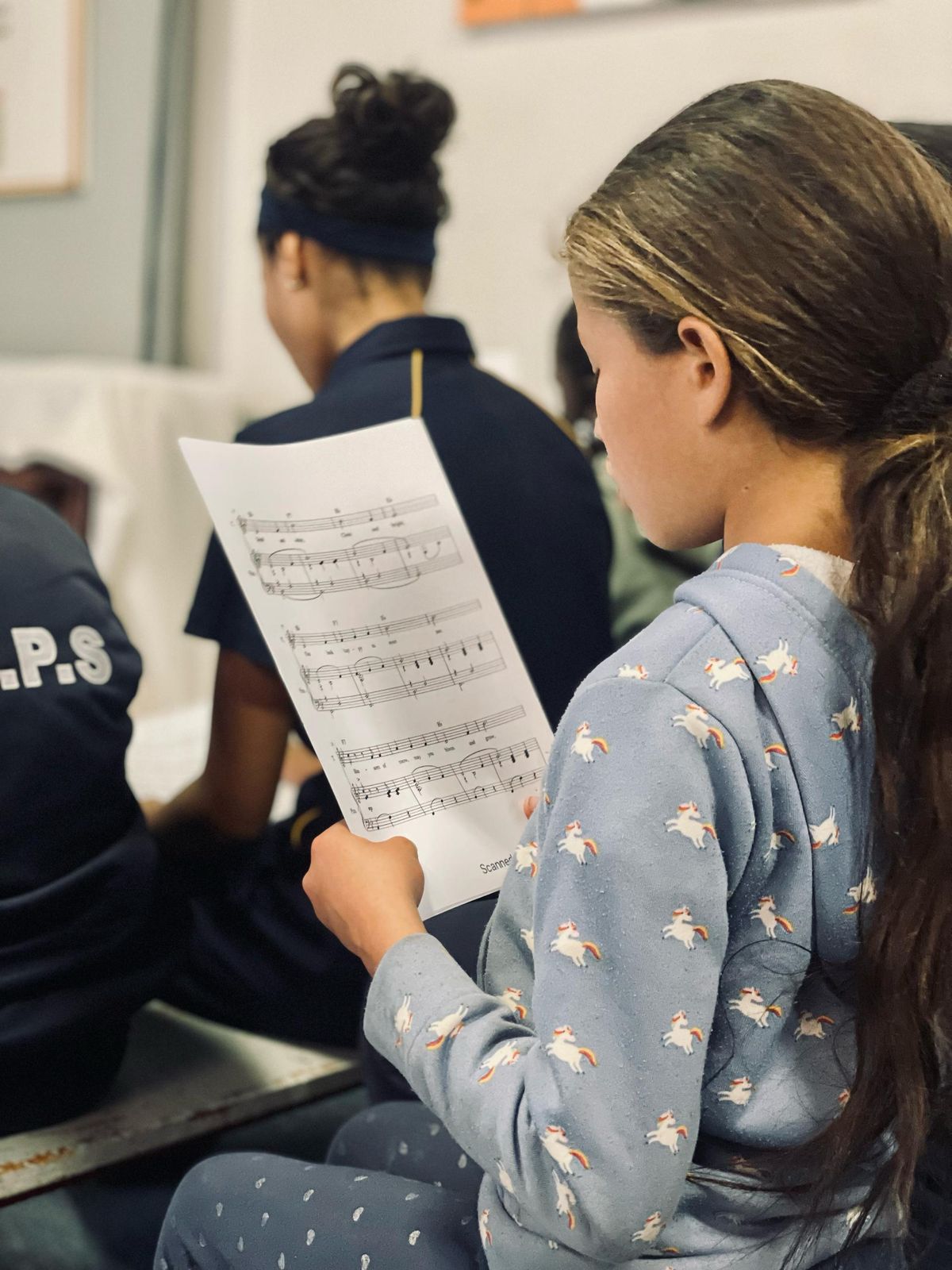 Student reading sheet music